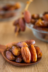 Kurma or dates on wooden background