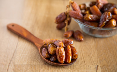 Kurma or dates on wooden background