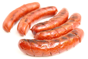 Grilled sausages isolated on a white background