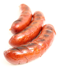 Grilled sausages isolated on a white background