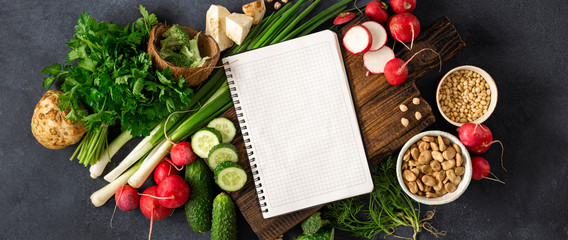 Obraz na płótnie Canvas Diet Food Concept. Healthy vegan eating. Blank notebook with fresh vegetables, herbs, cereal and nuts. Veggie Cooking