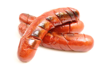 Grilled sausages isolated on a white background