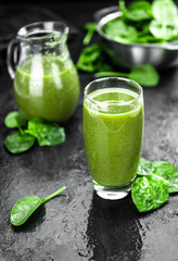 Freshly made spinach smoothie (close up; selective focus)
