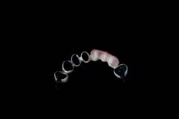 Fotobehang dentures in dentistry with teeth and masses © florinfaur