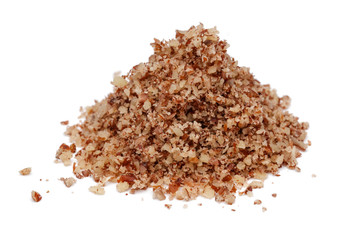 Heap of granulated pecan nut isolated