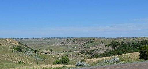 Fototapeta na wymiar Late Spring in the North Dakota Badlands: Looking Northeast From the Boicourt Overlook Across the Scenic Loop Road in the South Unit of Theodore Roosevelt National Park