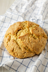 Homemade Irish Soda Bread on cloth, low angle view. Close-up.