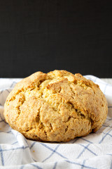 Homemade Irish Soda Bread on cloth, low angle view. Close-up.