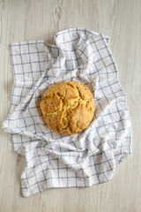 Homemade Irish Soda Bread on a white wooden surface, top view. Flat lay, overhead, from above.