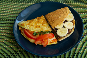 Oatmeal with peanut paste and bananas and oatmeal with cheese and tomatoes with greens