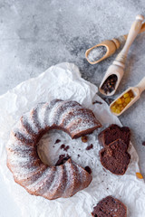 Round chocolate coffee cupcake with raisins and poppy