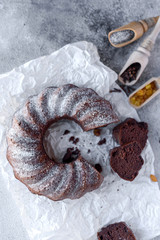 Round chocolate coffee cupcake with raisins and poppy