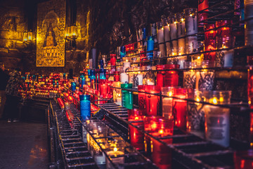 Candles in Montserrat monastery on mountain in Barcelona, Catalonia.