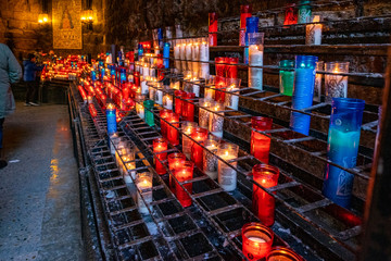 Candles in Montserrat monastery on mountain in Barcelona, Catalonia.