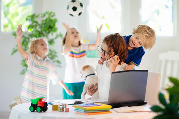 Mother working from home with kids. Quarantine.