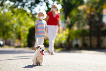 Obraz premium Family walking dog during virus outbreak