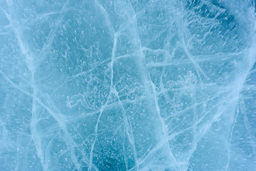 Beautiful ice of Lake Baikal with abstract cracks