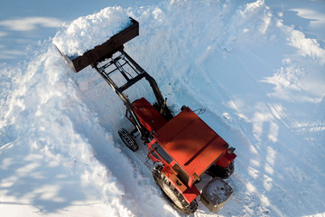 Snow plowing with agricultural tractor photographed from above.  Ratu, Robertsfors