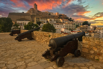 Fototapeta na wymiar Cannons in Ibiza town at sunset, Balearic Islands
