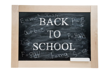School blackBoard in a wooden frame and chalk with the text written in chalk back to school. Isolated on white background.