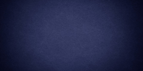 Texture of old navy blue grunge paper closeup
