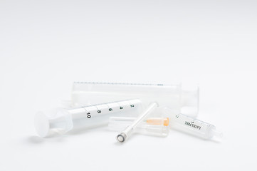 Empty syringes and needles on white background in studio, Covid-19