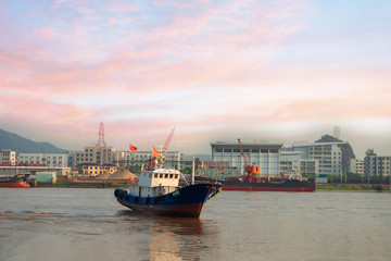 The stranded fishing boat at dusk.