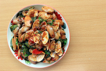 Top view image. Stir fried striped clams with basil