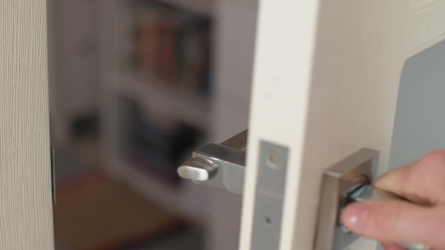 The hand is taken by the door handle