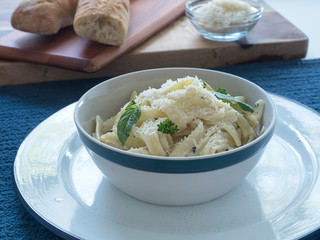 Pasta Alfredo Individual Bowl with Bread and Parmesan Horiz