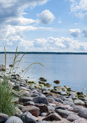 Finnish summer beach with pebbles and fair weather skies