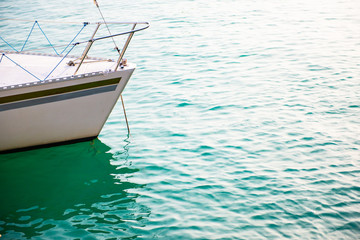 Ship's bow and aquamarine water, lake Garda. Boat and sea, detail © Khorzhevska