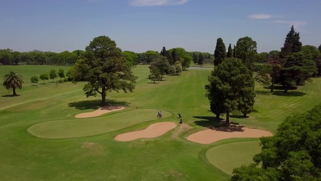 AERIAL: An argentinian flag flies over a golf course
