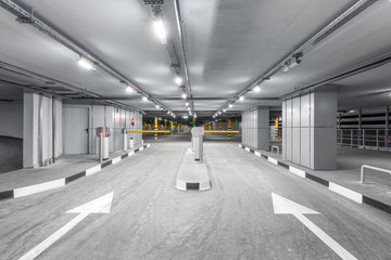 Entrance gate to underground garage parking. Automobile parking inside.