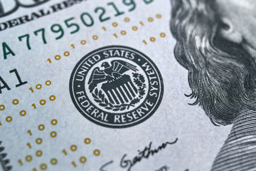 macro photo of federal reserve system symbol on hundred dollar bill. shallow focus. close-up with fine and sharp texture - obrazy, fototapety, plakaty