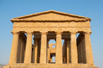 Obraz premium Valley of the Temples (Valle dei Templi), an ancient Greek Temple built in the 5th century BC, Agrigento, Sicily. Famous tourist attraction in Italy. Old marble columns of the Doric order