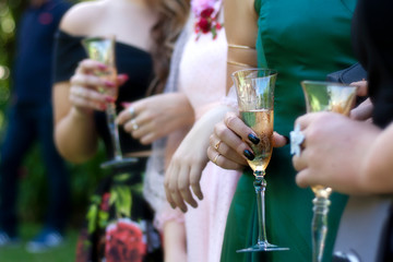 A row of women with champagne