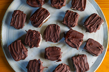 Chocolate bars with mint, chocolate shortbread crust and melted chocolate 