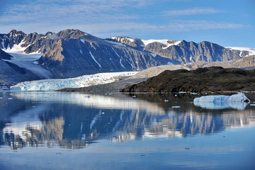 Blue ice drifting iceberg. Landscape of the Svalbard archipelago.