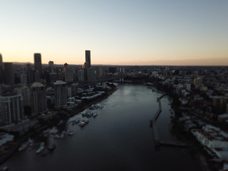 A photo of the Brisbane river with the story bridge being focused on 