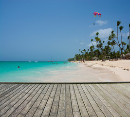 Empty wooden platform beside tropical beach at Punta Cana, Dominican Republic