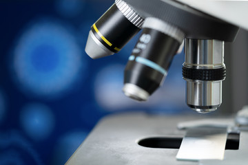 Close-up microscope with metal lens for laboratory research.