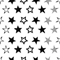 Seamless background of doodle stars. Black hand drawn stars on white background. Vector illustration
