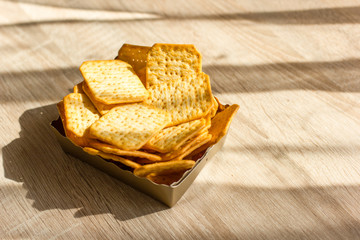 Cookies in a cardboard basket on the table