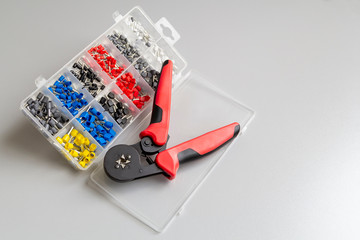 Tool and materials for stripping and crimping the tips of stranded electrical wires.