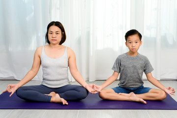 Mom teach yoga to her son
