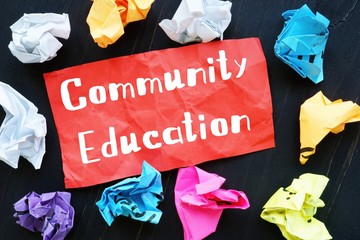 Business concept about Community Education with phrase on the piece of paper.