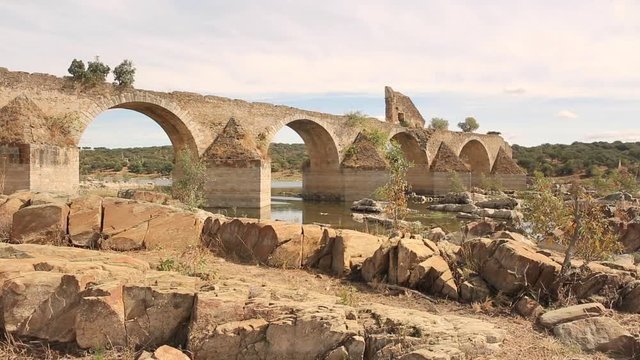 ruins of the Ajuda bridge over the Guadiana river in the ancient road between Elvas and Olivenza, Extremadura, Portugal/Spain