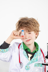 young doctor looks at the finished vaccine in the bottle