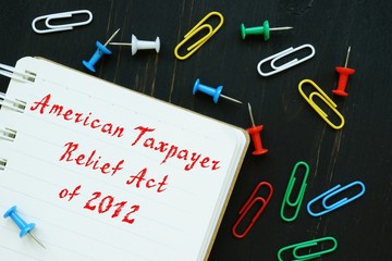 Business concept meaning American Taxpayer Relief Act Of 2012 with phrase on the piece of paper.